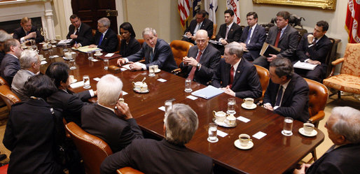 President George W. Bush meets with G7 finance ministers and heads of international finance institutions Saturday, Oct. 11, 2008, in the Roosevelt Room of the White House. President Bush joined from left to right Counselor to the President Ed Gillespie, Chief of Staff Joshua Bolten, Secretary of State Condoleezza Rice, Treasury Secretary Henry Paulson, National Security Advisor Stephen Hadley, and Mario Draghi, chairman, Financial Stability Forum, and finance ministers of America's partners in the G7, Canada, France, Germany, Great Britain, Italy and Japan. White House photo by Eric Draper