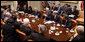 President George W. Bush meets with G7 finance ministers and heads of international finance institutions Saturday, Oct. 11, 2008, in the Roosevelt Room of the White House. President Bush joined from left to right Counselor to the President Ed Gillespie, Chief of Staff Joshua Bolten, Secretary of State Condoleezza Rice, Treasury Secretary Henry Paulson, National Security Advisor Stephen Hadley, and Mario Draghi, chairman, Financial Stability Forum, and finance ministers of America's partners in the G7, Canada, France, Germany, Great Britain, Italy and Japan. White House photo by Eric Draper
