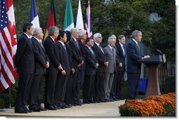 President George W. Bush delivers remarks after meeting with G7 finance ministers and heads of international finance institutions, Saturday morning, Oct. 11, 2008, in the Rose Garden at the White House. Pictured with President Bush from left to right are, Chairman of the Financial Stability Forum Mario Draghi, IMF Managing Director Dominique Strauss-Kahn, Eurogroup Chairman and Prime Minister of Luxembourg Jean-Claude Juncker, Japan's Finance Minister Soichi Nakagawa, Secretary of State Condoleezza Rice, Treasury Secretary Henry Paulson, France's Finance Minister Christine LeGarde, Canada's Finance Minister Jim Flaherty, Britain's Chancellor of the Exchequer Alister Darling, Italy's Economy Minister Giulio Tremonti, Germany's Finance Minister Peer Steinbruck and World Bank President Robert Zoellick. White House photo by Eric Draper