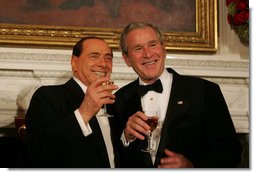 President George W. Bush and Italian Prime Minister Silvio Berlusconi raise their glasses in a toast Monday evening, Oct. 13, 2008, during a State Dinner in honor of Prime Minister Berlusconi's visit to the White House. White House photo by Joyce N. Boghosian