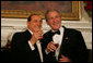 President George W. Bush and Italian Prime Minister Silvio Berlusconi raise their glasses in a toast Monday evening, Oct. 13, 2008, during a State Dinner in honor of Prime Minister Berlusconi's visit to the White House. White House photo by Joyce N. Boghosian