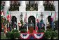 President George W. Bush listens as Prime Minister Silvio Berlusconi of Italy addresses his remarks Monday, Oct. 13, 2008, during ceremonies on the South Lawn to welcome Prime Minister Berlusconi to the White House. White House photo by Chris Greenberg