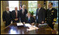 President George W. Bush is joined in the Oval Office Tuesday, Oct. 14, 2008, for the signing of S. 3001, the Duncan Hunter National Defense Authorization Act for Fiscal Year 2009. With him from left are: U.S. Secretary of Defense Robert Gates, U.S. Senator Carl Levin, D-Mich.; U.S. Senator John Warner, R-Va.; President Bush; Republican Congressman Duncan Hunter of California, and Admiral Mike Mullen, Chairman of the Joint Chiefs of Staff. White House photo by Joyce N. Boghosian