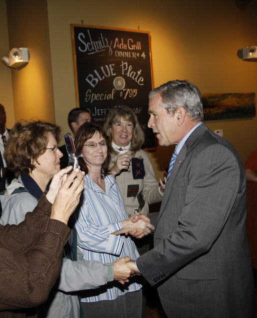 President George W. Bush greets diners Wednesday, Oct. 15, 2008, at the Schnitz Ada Deli and Grill in Ada, Michigan. The President met with business owners from the Grand Rapids area over lunch at the deli to talk about the economy. White House photo by Eric Draper