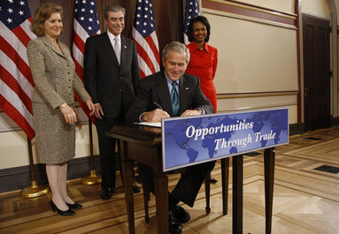 President George W. Bush signs H.R. 7222, the Andean Trade Preference Act Extension Thursday, Oct. 16, 2008, in the Eisenhower Executive Office Building. The bill will extend the Generalized Systems of Preferences (GSP), designed to help developing countries expand their market presence and strengthen their economies, and the Andean Trade Pact, which waives duties on imports from Bolivia, Colombia, Ecuador, and Peru in accordance with a 1991 law. Looking on are Ambassador Susan Schwab, the U.S. Trade Representative, U.S. Secretary of Commerce Carlos Gutierrez and U.S. Secretary of State Condoleezza Rice. White House photo by Eric Draper