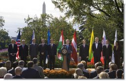 Joined on stage by U.S. Secretary of State Condoleezza Rice, Director Michael Chertoff of the Department of Homeland Security, left, and ambassadors of countries joining the Visa Waiver program, President George W. Bush delivers a statement on the program Friday, Oct. 17, 2008, in the Rose Garden of the White House. Said the President, "I'm pleased to stand with the representatives of seven countries -- the Czech Republic, Estonia, Hungary, Latvia, Lithuania, Slovakia, and South Korea -- that have met the requirements to be admitted to the United States Visa Waiver Program. Soon the citizens of these nations will be able to travel to the United States for business or tourism without a visa. I congratulate these close friends and allies on this achievement, and I thank you for joining us here."  White House photo by Joyce N. Boghosian