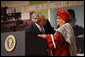 After being introduced President George W. Bush embraces Liberian President Ellen Johnson Sirleaf at the White House Summit Tuesday, Oct. 21, 2008, in Washington, D.C. President Bush discussed in his remarks core transformational goals of country ownership, good governance, results-based programs and accountability, and the importance of economic growth. White House photo by Eric Draper