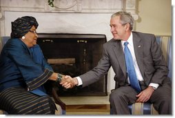 President George W. Bush shakes hands with Liberia President Ellen Johnson Sirleaf following their meeting Wednesday, Oct. 22, 2008, in the Oval Office at the White House. President Bush said to President Sirleaf, "I have come to respect you and admire you because of your courage, your vision, your commitment to universal values and principles." White House photo by Eric Draper