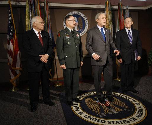 President George W. Bush delivers a statement to the press at the end of his visit Friday, Oct. 24, 2008, to the National Security Agency at Fort Meade, Md. With him are Vice President Dick Cheney, Lt. Gen. Keith B. Alexander, Director of the NSA, and Director of National Intelligence Mike McConnell. White House photo by Eric Draper
