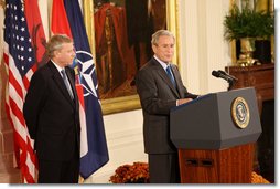 President George W. Bush is joined by NATO Secretary General Jaap De Hoop Scheffer as he addresses his remarks to invited guests Friday, Oct. 24, 2008 in the East Room of the White House, prior to signing the NATO accession protocols in support of the nations of Albania and Croatia to join the NATO alliance. White House photo by Chris Greenberg