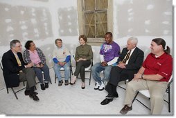 Mrs. Laura Bush visits with Mr. Jim Kelly, CEO and co-president of Catholic Charities Archdiocese of New Orleans, left; homeowner Mrs. Joeretta Roman, Ms. Nancy Parlin, Consociate Candidate, Sisters of St. Joseph of the Province of St. Paul, third from left; Mr. Ashton Johnson, student YouthBuild Helping Hands; Mr. Doug O'Dell, Federal Coordinator, Office of the Federal Coordinator for Gulf Coast Rebuilding, 2nd right, and Mr. Kevin Fitzpatrick, Volunteer Housing Coordinator, Operation Helping Hands, right, Thursday, October 30, 2008, in New Orleans, La., during a tour of the home of Joretta Roman which is being rennovated by Catholic Charities Operation Helping Hands after sustaining damage from Hurricane Katrina. White House photo by Chris Greenberg