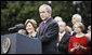 With Mrs. Laura Bush, the Vice President and Mrs. Cheney and Cabinet secretaries looking on, President George W. Bush addresses his staff Thursday, Nov. 6, 2008, on the South Lawn of the White House. Said the President, "As we head into this final stretch, I ask you to remain focused on the goals ahead. I will be honored to stand with you at the finish line." White House photo by Eric Draper