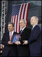 President George W. Bush is presented with the 2008 Intrepid Freedom Award by Rich Santulli, left, and Charles de Gunzberg, co-chairmen of the Intrepid Sea, Air and Space Museum, Tuesday, Nov. 11, 2008, during the rededication of the museum on Veteran's Day in New York. The award recognizes world leaders who embody the ideals of world freedom and democracy. White House photo by Eric Draper