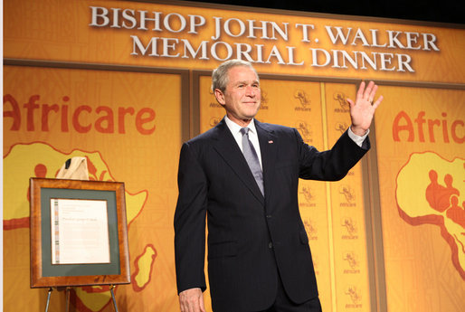 President George W. Bush waves as he acknowledges applause folllowing his remarks Wednesday evening, Nov. 12, 2008, at the 2008 Bishop John T. Walker Memorial Dinner in Washington, D.C., where President Bush was honored with the Bishop John T. Walker Distinguished Humanitarian Service Award from Africare. White House photo by Chris Greenberg