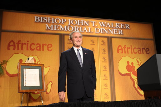 President George W. Bush pauses to acknowledge applause folllowing his remarks Wednesday evening, Nov. 12, 2008, at the 2008 Bishop John T. Walker Memorial Dinner in Washington, D.C., where President Bush was honored with the Bishop John T. Walker Distinguished Humanitarian Service Award from Africare. White House photo by Chris Greenberg