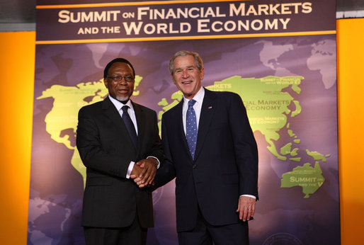 President George W. Bush welcomes South Africa President Kgalema Motlanthe to the Summit on Financial Markets and the World Economy Saturday, Nov. 15, 2008, at the National Building Museum in Washington, D.C. White House photo by Chris Greenberg