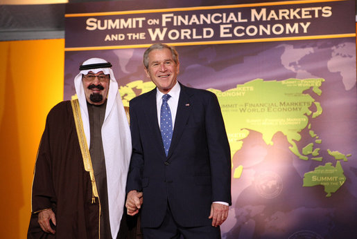 President George W. Bush welcomes Saudi Arabia King Abdullah bin Abdul Aziz Al Saud to the Summit on Financial Markets and the World Economy Saturday, Nov. 15, 2008, at the National Building Museum in Washington, D.C. White House photo by Chris Greenberg
