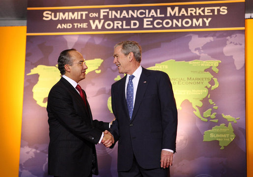 President George W. Bush welcomes Mexico's President Felipe Calderon to the Summit on Financial Markets and the World Economy Saturday, Nov. 15, 2008, at the National Building Museum in Washington, D.C. White House photo by Chris Greenberg