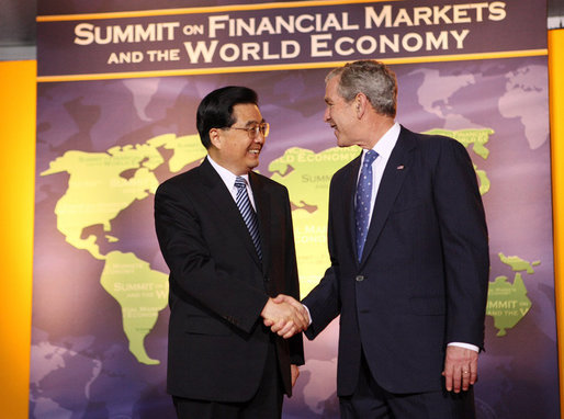 President George W. Bush welcomes the People's Republic of China President Hu Jintao to the Summit on Financial Markets and the World Economy Saturday, Nov. 15, 2008, at the National Building Museum in Washington, D.C. White House photo by Chris Greenberg