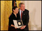 President George W. Bush congratulates Carla Maxwell, artistic director of the Jose Limon Dance Foundation of New York, as a recipient of the 2008 National Medal of Arts in ceremonies Monday, Nov. 17, 2008 at the White House. White House photo by Joyce N. Boghosian
