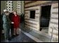 Mrs. Laura Bush tours a replica Log Cabin of Abraham Lincoln's Birthplace during her visit to the Abraham Lincoln Birthplace National Historic Site Tuesday, Nov. 18, 2008, in Hodgenville, KY. Mrs. Bush is led on the tour by Ms. Sandy Brue, Chief of Interpretation and Resource Management, Abraham Lincoln Birthplace National Historic Site. White House photo by Joyce N. Boghosian