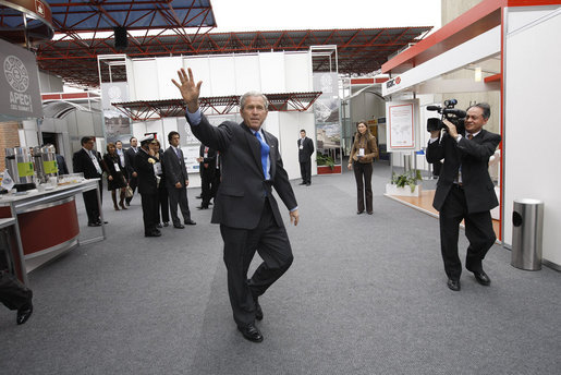 President George W. Bush waves to the media as he arrives Saturday, Nov. 22, 2008, at the Ministry of Defense Convention Center in Lima, Peru, where he addressed the APEC CEO Summit 2008. White House photo by Eric Draper