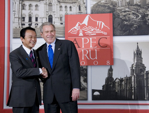 President George W. Bush and Prime Minister Taro Aso of Japan pause for photographs prior to their meeting Saturday, Nov. 22, 2008, in Lima, Peru. White House photo by Eric Draper