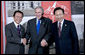 President George W. Bush is flanked by Prime Minister Taro Aso of Japan, left, and President Lee Myung-bak of the Republic of Korea, prior their trilateral meeting Saturday, Nov. 22, 2008, in Lima Peru. White House photo by Eric Draper