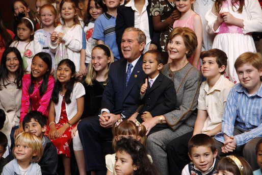 President George W. Bush and Mrs. Laura Bush sit for a photo with the children of U.S. Embassy staff Sunday, Nov. 23, 2008, in Lima. Peru. White House photo by Eric Draper