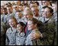 President George W. Bush stands with troops on stage Tuesday, Nov. 25, 2008, at Fort Campbell, Ky., one of the Army's premier training and deployment installations and home of the Screaming Eagles of the 101st Airborne. White House photo by Eric Draper