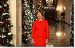 Mrs. Laura Bush stands in the East Room of the White House Wednesday, Dec. 3, 2008, as she reveals the 2008 White House holiday theme, "A Red, White and Blue Christmas" to approximately 120 members of the media during the White House Holiday Press Preview.  White House photo by Chris Greenberg