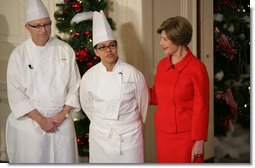 Mrs. Laura Bush is joined by White House Executive Chef Cris Comerford, and Bill Yosses, White House Pastry Chef, during the 2008 White House Holiday Press Preview Wednesday, Dec. 3., 2008, in the East Room. Said Mrs. Bush, "This is a special holiday for us. our final in the White House. Thank you to the American people for their friendship, prayers, and support. The President and I wish you and your families a very happy holiday."  White House photo by Shealah Craighead