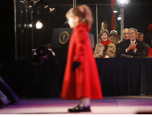 President George W. Bush and Mrs. Laura Bush watch four-year-old singer Kaitlyn Maher perform on the Ellipse Thursday, Dec. 4, 2008, prior to the Lighting of the National Christmas Tree in Washington, D.C. White House photo by Eric Draper