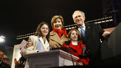President George W. Bush and Mrs. Laura Bush are joined by tree lighters Kayleigh Kepler, 11, left, and Lindsey Van Horn, 9, during the 2008 Lighting of the National Christmas Tree Thursday, Dec. 4, 2008, on the Ellipse in Washington, D.C. White House photo by Eric Draper