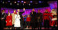 President George W. Bush and Mrs. Laura Bush stand on stage Thursday, Dec. 4, 2008, with Santa, entertainers and guests, during the 85th Lighting of the National Christmas Tree on the Ellipse in Washington, D.C. With them, from left, are: Members of Step Afrika!; Lindsey Van Horn, 9, and Kayleigh Kepler, 11, the official tree lighters; Phil Vassar; Jon Secada, and Santa and his elf. White House photo by Eric Draper