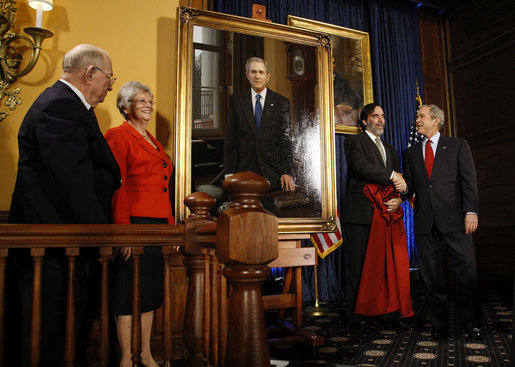 President George W. Bush shakes hands with artist Mark Carder Saturday, Dec. 6, 2008, at the unveiling of the Union League of Philadelphia's Portrait of a President. Looking on at left are Bruce and Eileen Hooper, Commissioners of the portrait, which will join 26 others of American Presidents in the Union League's Presidential Portrait Collection. White House photo by Eric Draper
