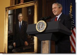 President George W. Bush stands next to his portrait as he delivers remarks Saturday, Dec. 6, 2008, to the Union League of Philadelphia. Founded in 1862, the Union League has hosted U.S. Presidents, heads of state, industrialists, entertainers and visiting dignitaries from around the globe. The portrait, painted by Mark Carder and presented by the League, will become part of its Presidential Portrait Collection.  White House photo by Eric Draper