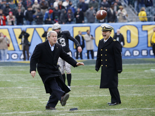 President George W. Bush playfully kicks a 15-yarder from around the 30 yard line Saturday, Dec. 6, 2008, as he took the field at Philadelphia's Lincoln Financial Field for the 2008 Army-Navy game. The Commander in Chief was headed to midfield for the coin toss, when he spotted the ball on the tee and went for it. White House photo by Eric Draper
