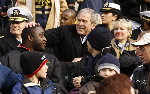 President George W. Bush spends the third quarter in the Navy stands with military personnel wounded in Iraq and Afghanistan as they cheer for the Midshipmen, who eventually defeated the Black Knights in the 2008 Army-Navy game at Lincoln Financial Field in Philadelphia. White House photo by Eric Draper