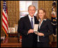 President George W. Bush stands with Wendy Kopp after presenting her with the 2008 Presidential Citizens Medal Wednesday, Dec. 10, 2008, in the Oval Office of the White House. White House photo by Chris Greenberg