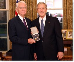 President George W. Bush stands with Don Powell after presenting him with the 2008 Presidential Citizens Medal Wednesday, Dec. 10, 2008, in the Oval Office of the White House.  White House photo by Chris Greenberg