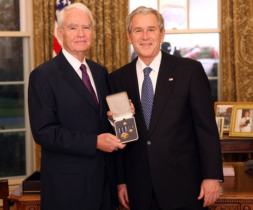 President George W. Bush stands with Don Powell after presenting him with the 2008 Presidential Citizens Medal Wednesday, Dec. 10, 2008, in the Oval Office of the White House. White House photo by Chris Greenberg