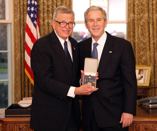 President George W. Bush stands with Chuck Colson after presenting him with the 2008 Presidential Citizens Medal Wednesday, Dec. 10, 2008, in the Oval Office of the White House. White House photo by Chris Greenberg