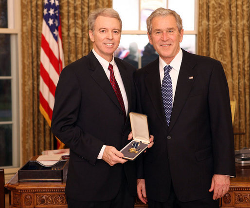 President George W. Bush stands with Dr. Don Landry after presenting him with the 2008 Presidential Citizens Medal Wednesday, Dec. 10, 2008, in the Oval Office of the White House. White House photo by Chris Greenberg