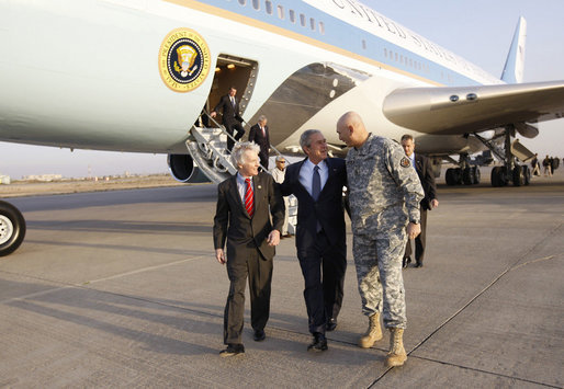 President George W. Bush is greeted to Baghdad International Airport by U.S. Ambassador to Iraq Ryan Crocker, left, and U.S. Commander in Iraq, General Ray Odierno, Sunday, Dec. 14, 2008 in Baghdad, where President met with Iraqi leaders and visited with U.S. military personnel. White House photo by Eric Draper