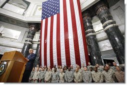 President George W. Bush addresses U.S.military and diplomatic personnel Sunday, Dec, 14, 2008, at the Al Faw Palace-Camp Victory in Baghdad, following his meetings with Iraqi leaders and the signing of strategic and security agreements.  White House photo by Eric Draper