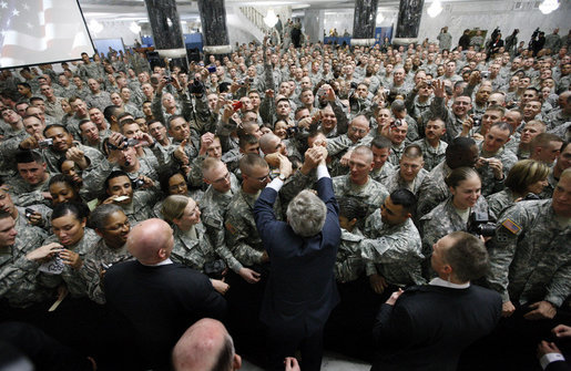 President George W. Bush reaches to shake as many hands as possible as he meets with U.S. military and diplomatic personnel Sunday, Dec, 14, 2008, at the Al Faw Palace-Camp Victory in Baghdad. White House photo by Eric Draper