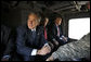 President George W. Bush, joined by U.S. Ambassador to Iraq Ryan Crocker, center, rides in a military helicopter Sunday, Dec. 14. 2008, from Baghdad International Airport to Salam Palace in Baghdad, where President Bush met with Iraqi leaders. White House photo by Eric Draper