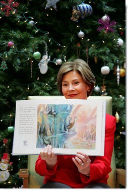 Mrs. Laura Bush shows off the illustrations in "My Penguin Osbert" Monday, Dec. 15, 2008, which she read to young patients and their families at Children's National Medical Center in Washington, D.C. Mrs. Bush explained that the book is about what you do when you write Santa a letter. Mrs. Bush also visited with patients and debuted the new Barney Cam VII: A Red, White & Blue Christmas for the kids.  White House photo by Joyce N. Boghosian