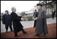 President George W. Bush is greeted by President Hamid Karzai upon arrival Monday morning, Dec. 15, 2008, at the Afghanistan leader's presidential palace in Kabul. White House photo by Eric Draper